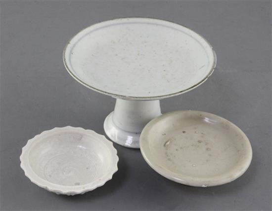 A Chinese Qingbai cup stand, Song dynasty, a Wanli petal lobed small dish or stand, and a Qing dynasty porcelain stem dish, diameter 7.
